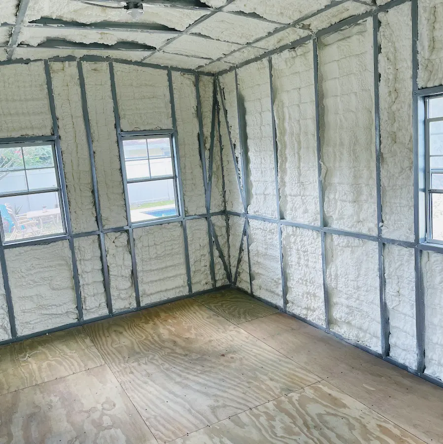 Closed-cell spray foam insulation applied to wall cavities in a residential project in Carolina Shores